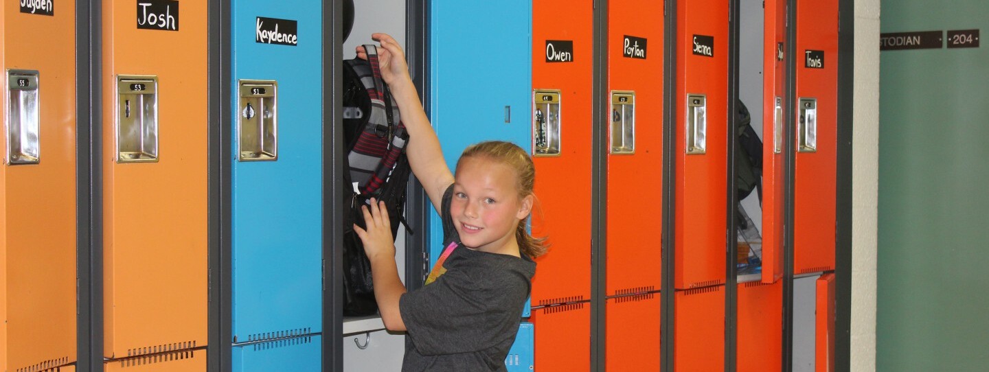 student at her locker